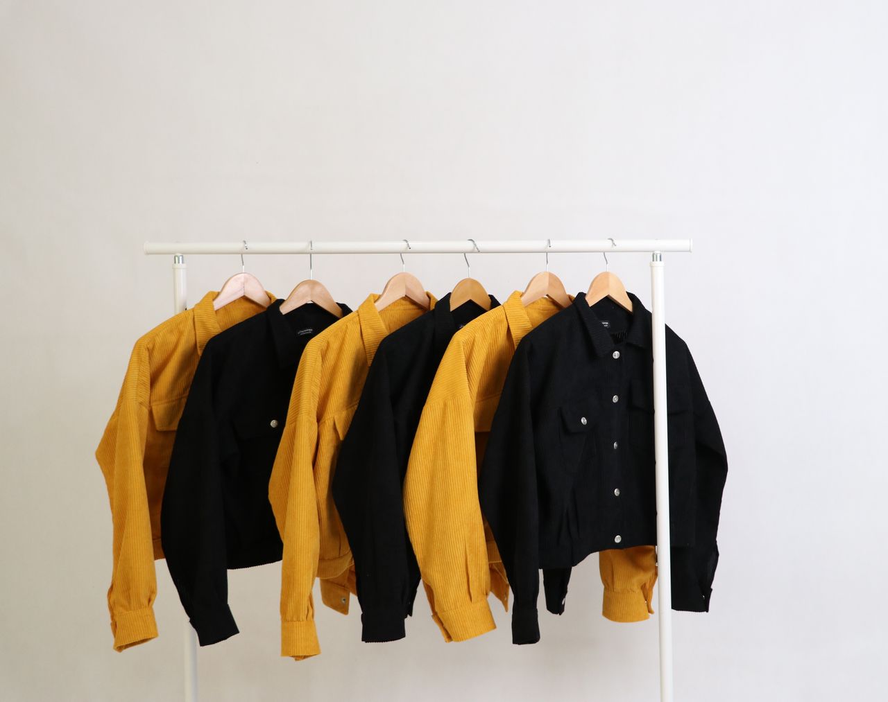 digital Stylish yellow and black jackets on display, perfect for fashion photography and minimalistic themes.